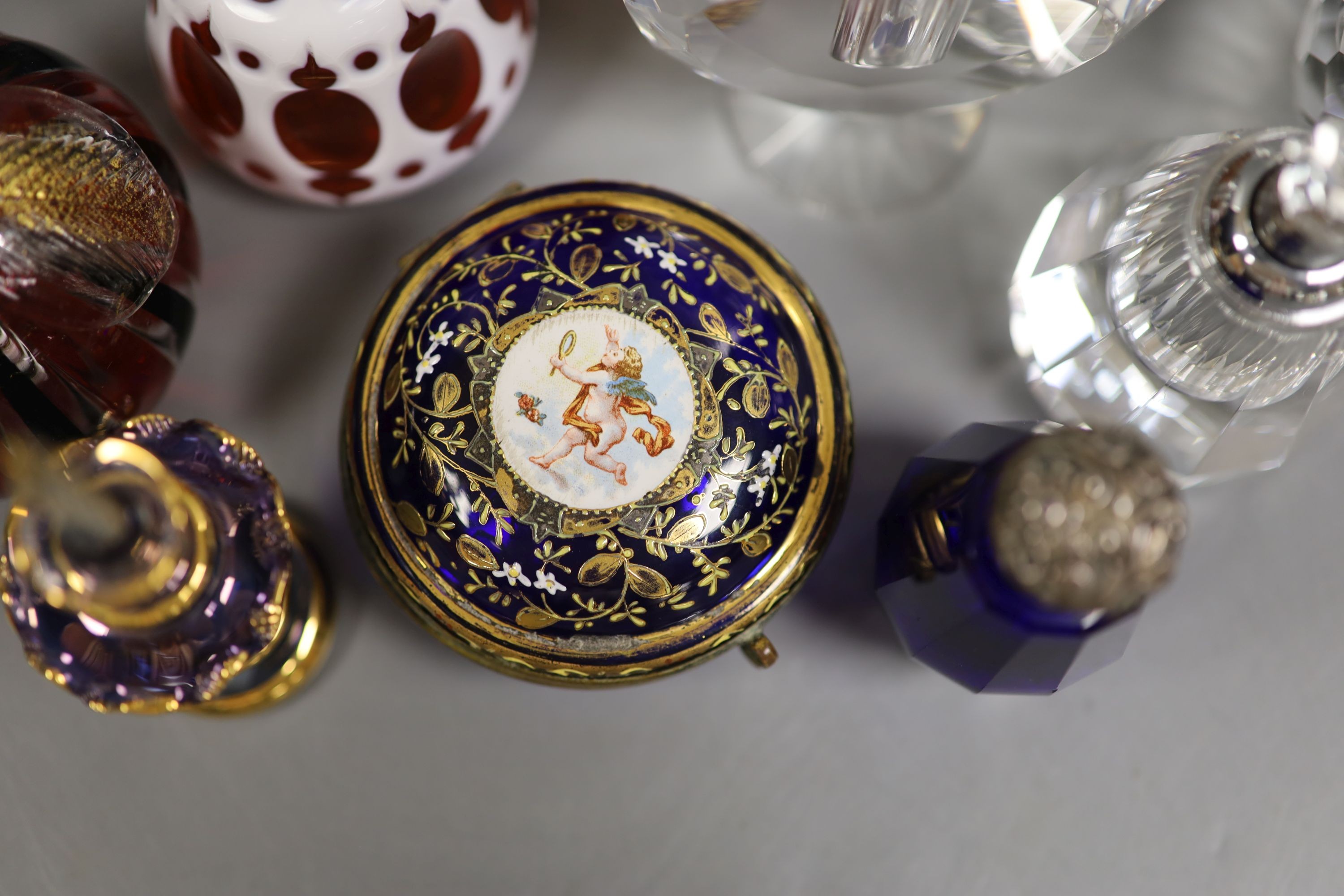 A collection of various glass scent bottles including a Lalique flower scent bottle and Bohemian examples, tallest 20.5cm